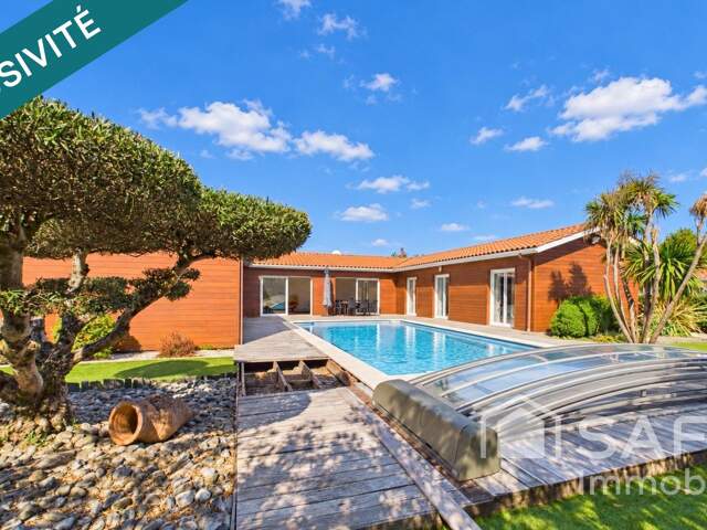 Magnifique maison de plain-pied avec 5 chambres et piscine couverte — photo du bien