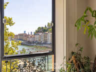 Appartement à l'élégance architecturale suspendue sur la Saône — photo 4