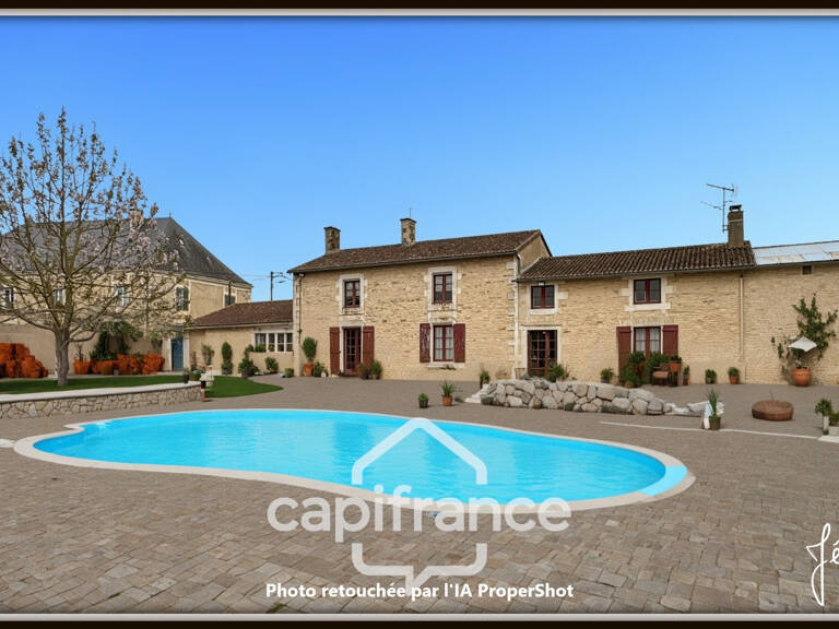 Maison en pierre à vendre 6 pièces 4 chambres + studio indépendant sur terrain 3 260 m² avec dépendances Champigny-En-Rochereau (86) — photo 1