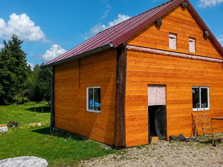 VILLERS-LES-BOIS – DEUX CHALETS EN BOIS – TERRAIN CLOS — photo 1