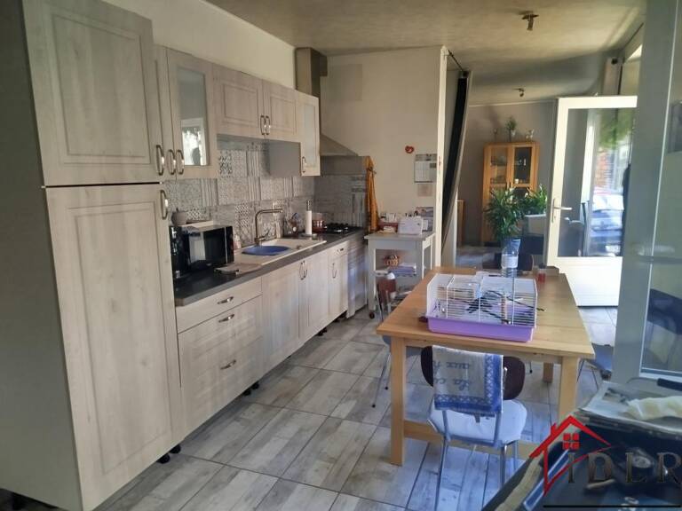 ENSEMBLE IMMOBILIER COMPOSE DE 3 MAISONS — photo 1