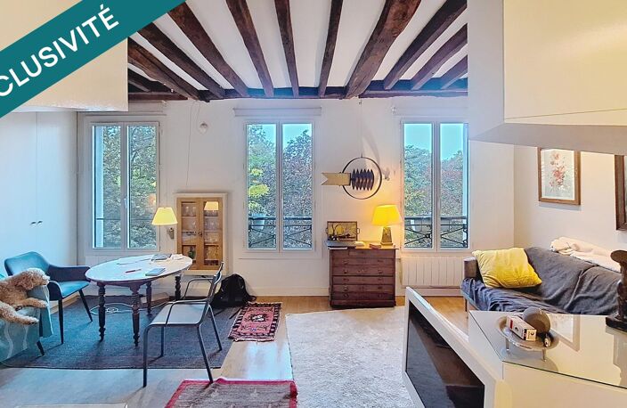 PARIS 19E  Appartement de 40,8 m² rénové par architecte  Vue sur les Buttes-Chaumont — photo 2