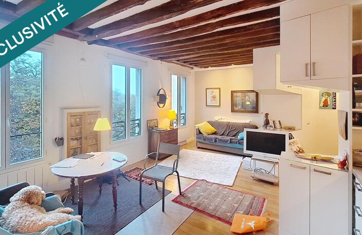 PARIS 19E  Appartement de 40,8 m² rénové par architecte  Vue sur les Buttes-Chaumont — photo 3