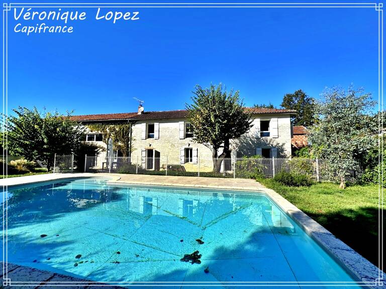 Feugarolles, belle longère en pierre rénovée de 289m² habitables avec jardin, piscine, atelier, séchoir à tabac — photo 1