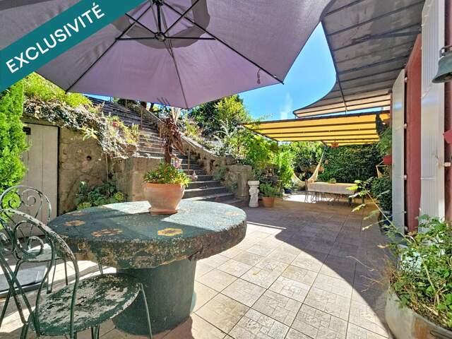 Une superbe maison de maître de 228 m² avec jardin, terrasse et fort potentiel au cœur de Graissessac. — photo du bien