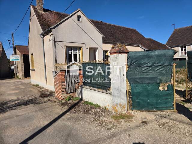 Maison 2 chambres avec garage et beau potentiel — photo du bien