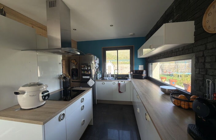 MAISON ELEVEE SUR DEMI SOUS-SOL AVEC TERRAIN ATTENANT — photo 5